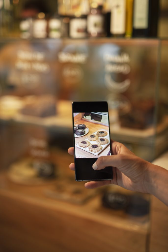 hand taking photos with smartphone close up